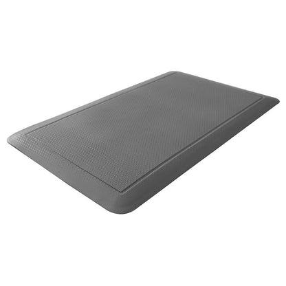 A gray rubber comfort mat on a white background