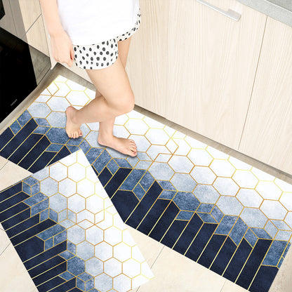 Woman standing on rectangular shaped absorbent home rugs printed with different colours and grids giving it a modern style.