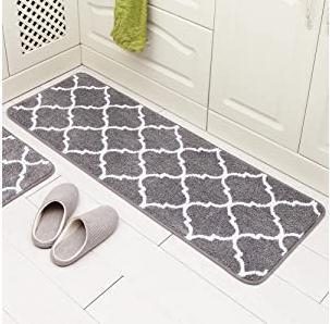Bathroom mats with grey grid colour style printed on it. 