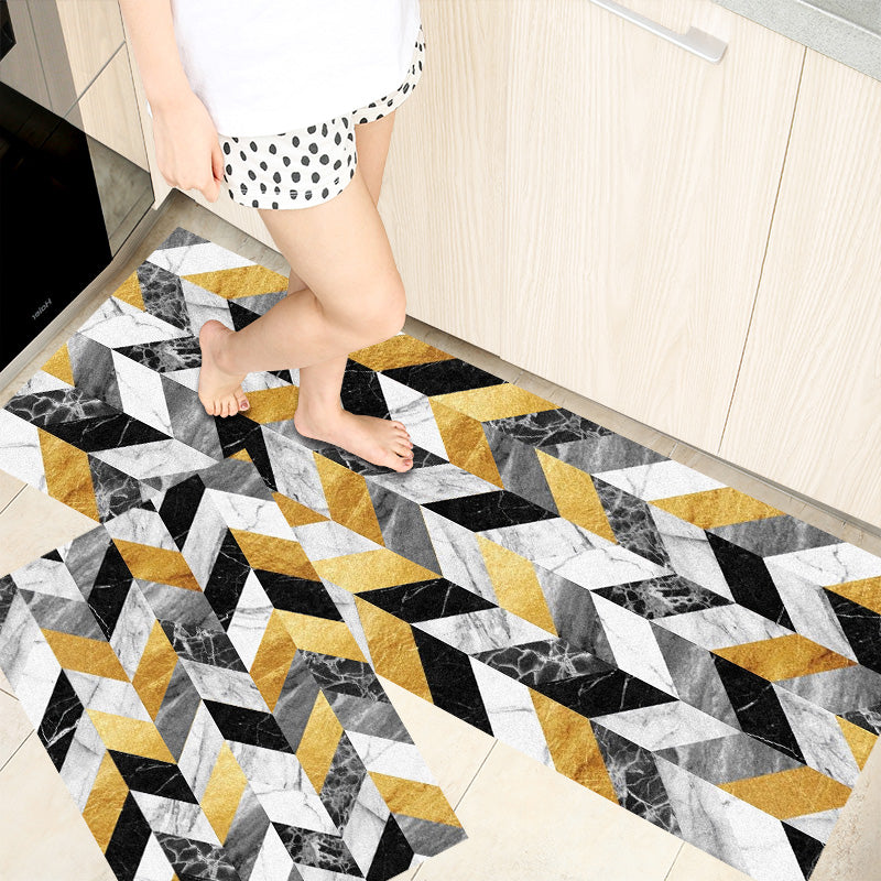 Woman standing on rectangle shaped home door rugs printed with different coloured grids on it giving it a modern look.