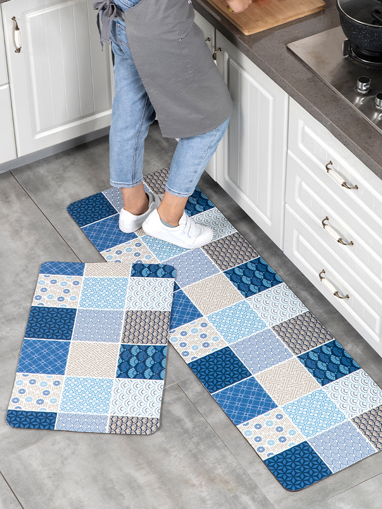 Woman standing on kitchen floor mat.