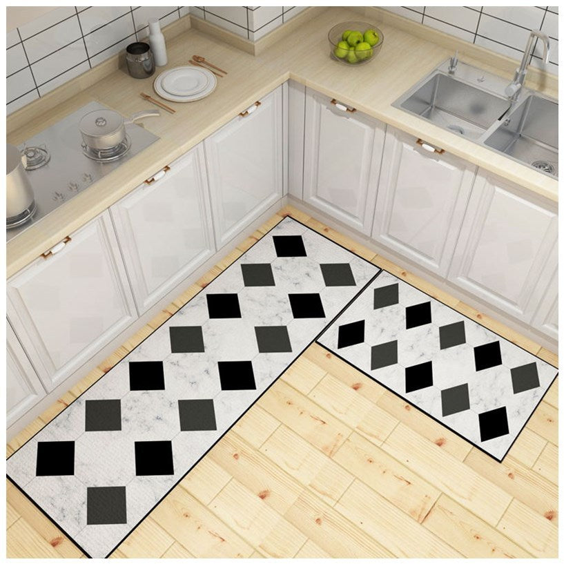 White Leather kitchen Mats with diamonds of black and grey colour printed on it.